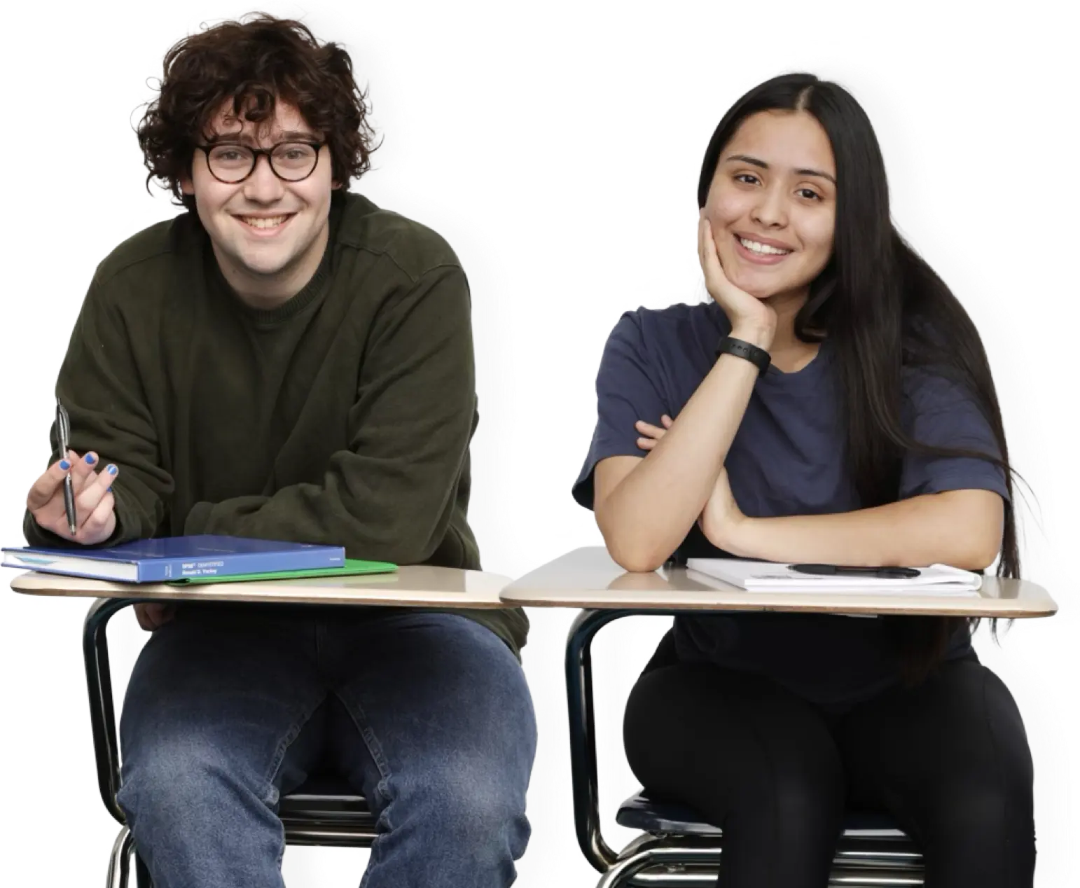 One teen girl and teen boy sitting at desks and smiling